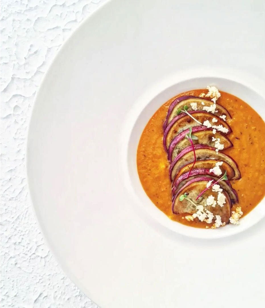 Baked Sweet Potato Chips on the bed of Arrabiatta with Feta & Microgreens
